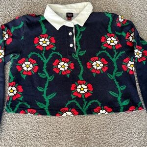 Rowing Blazers Black Sweater with Red Floral Design and Dress Trouser